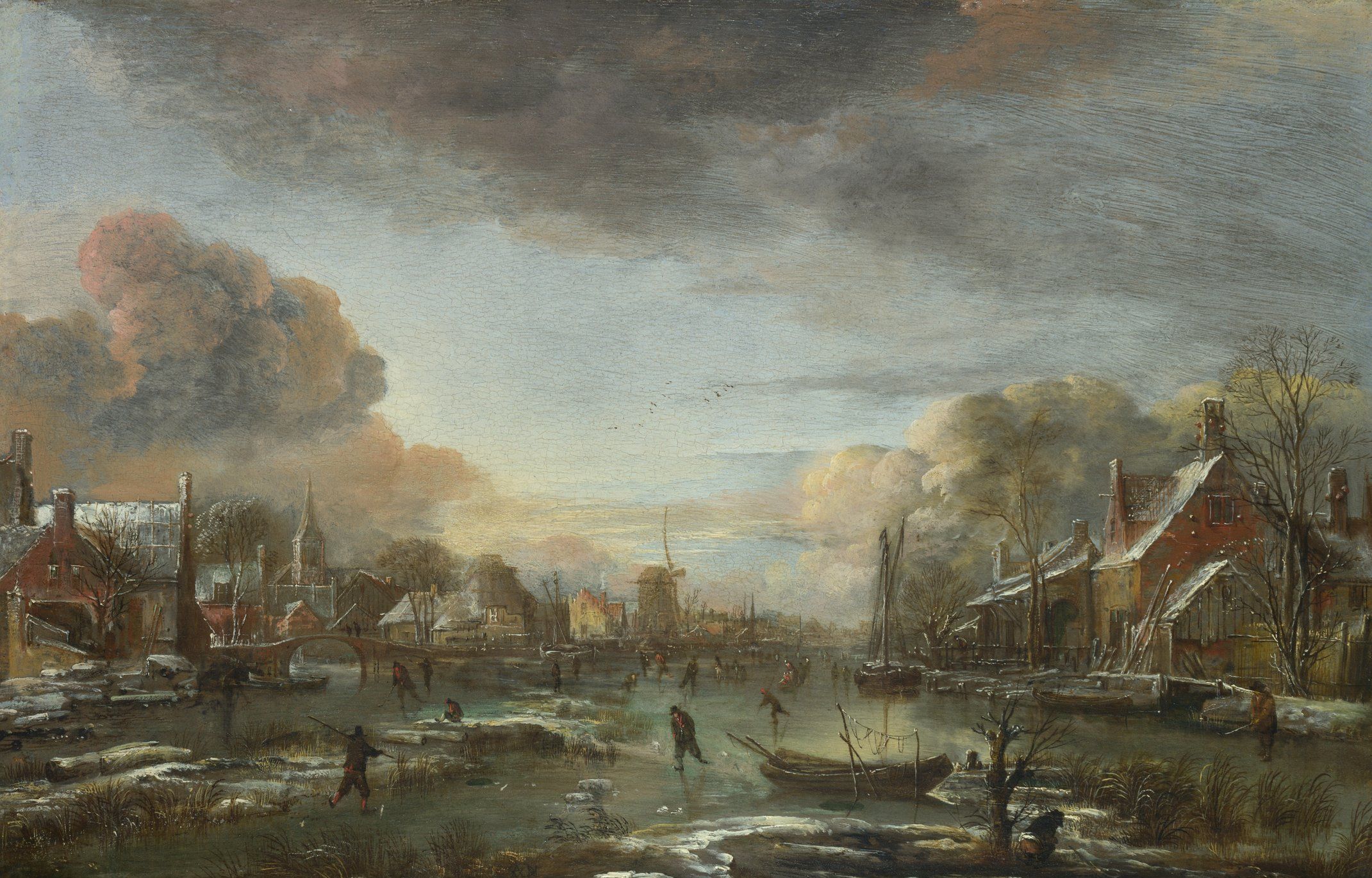 Aert van der Neer - A Frozen River by a Town at Evening